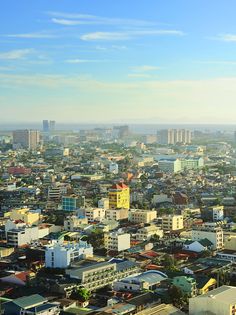 an aerial view of a city with tall buildings