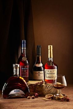 three different types of liquor sitting on top of a table