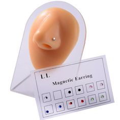 an image of magnetic earring on display in a card holder with instructions to use it