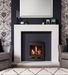 a living room with two chairs and a fire place in the middle of the room