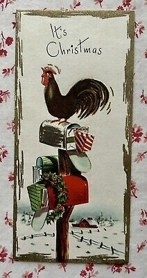 a christmas card with a rooster on top of a mailbox and an american flag