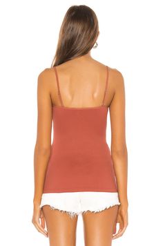 Copper Cami Top with Front Ring Accent: This stunning Free People Be My Baby Cami in copper features a unique front ring accent that adds a touch of personality and style.Adjustable Shoulder Straps and Stretch Fabric: The adjustable shoulder straps and stretch fabric ensure a comfortable and flattering fit for all body types.Versatile and Easy to Style: This cami can be dressed up or down, depending on the occasion. Pair it with jeans and sandals for a casual look, or with a skirt and heels for Spring Cami Top With Built-in Bra, Solid Color Cami Top With Built-in Bra, Fitted Cami Top With Built-in Bra, Seamless Sleeveless Tops For Loungewear, Solid Color Loungewear Camisole, Bra Friendly Tops For Loungewear, Sleeveless Tops With Built-in Bra For Layering, Chic Sleeveless Bra-friendly Tops, Solid Color Seamless Camisole