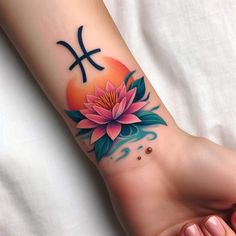 a woman's foot with a flower and piscum tattoo on the side