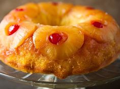 a pineapple upside down cake on a glass plate