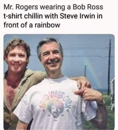 two men standing next to each other in front of a rainbow