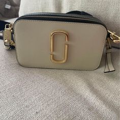 Authentic Marc Jacobs Snapshot Bag. Brand New And In Excellent Condition. Straps Can Be Changed Out. Nice Bag Fits A Lot!! Clean Not Smoking Home. Modern Cream Shoulder Bag With Branded Hardware, Designer Cream Shoulder Bag With Branded Hardware, Designer Cream Square Shoulder Bag, Beige Square Bag With Branded Hardware, Square Beige Bag With Branded Hardware, Cream Square Bag With Gold-tone Hardware, Square Cream Bag With Gold-tone Hardware, Evening Bags With Branded Hardware In Cream, Cream Evening Bags With Branded Hardware