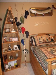 a bed room with a neatly made bed next to a book shelf filled with books