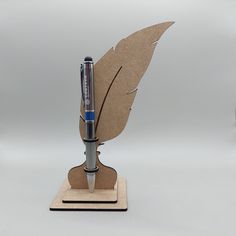 a pen is sitting on top of a piece of cardboard