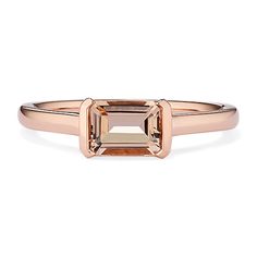 an 18k rose gold ring with a square cut diamond