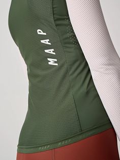 the back of a woman's green and white top with words on it that read parm