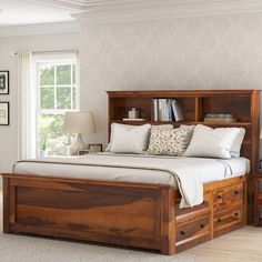 a bedroom with a bed, bookcase and nightstands in it's center