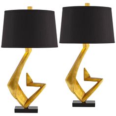 two lamps with black shades on them and one has an arrow shaped lamp in the middle