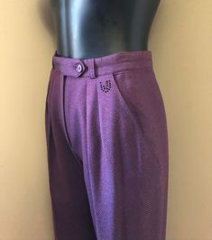 Vintage Emanuel Ungaro trousers. high waist. pleat front. tapered leg. ankle length. slant hip pockets. zip fly closure. crystal embellished logo at front waist. ✩ These pants are an amazing find, rare! Circa 1990s Emanuel Ungaro Made in Italy 100% Wool Eggplant Purple Excellent Condition. No notable flaws. ✂----M e a s u r e m e n t s: all in inches. Waist: 26 Hips: up to 38 Inseam: 26 Rise: 13 Length: 38 All measurements are taken flat. ❉ this is a vintage item and there is ONLY one! Item no. 60s Retro, Purple Pants, Emanuel Ungaro, Micro Mini Skirt, Eggplant Purple, 60s Dress, Office Outfits, Dark Purple, Tapered Legs