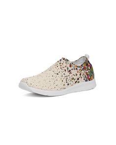 a women's white slip on shoe with multicolored dots and sequins