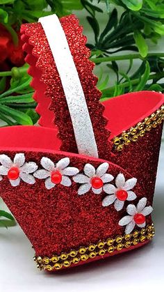 a red paper crown sitting on top of a table