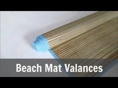 the beach mat valancees are made from bamboo and have blue tape on them