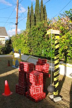 there are many pieces of art made out of bricks and construction cones in the yard