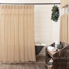 a bath room with a tub and a shower curtain