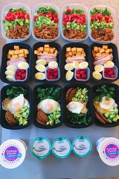 an assortment of food in plastic containers on a table