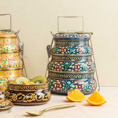 an assortment of colorful dishes and utensils on a table