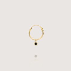 This irresistible hoop earring ornamented with a lustrous dangling black diamond is a tasteful piece to adorn your ear. Since this earring is sold in singles, you can mix and match with any other earring in our collection to suit your taste. *This earring is sold as singles perfect for helix, tragus or the third hole, you can mix and match with any other earring in our collection to suit your taste. All features can be customized! Please contact us if you wish to make changes, we love making cus Elegant Gold Earrings With Black Diamonds, Formal Black Diamond Cut Earrings, Black Diamond Cut Round Earrings, Black Diamond Hoop Earrings, Black Onyx Hoop Earrings, Gold Earring, Gold Hoops, Tragus, Gold Hoop Earrings