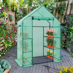 a small greenhouse with several plants growing inside