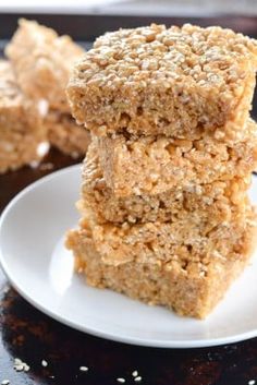 three pieces of oatmeal bars stacked on top of each other in a white plate