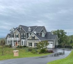 a large house with a driveway in front of it