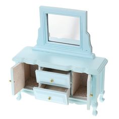 a small blue vanity with drawers and a mirror on the top shelf, in front of a white background