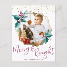 a merry and bright christmas card with a baby holding a teddy bear in it's lap