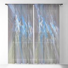 an abstract painting with blue and green colors is shown in front of a window curtain