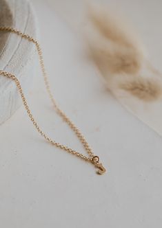 Is there anything sweeter than a tiny single initial? We don’t think so! 8 x 6mm uppercase block letter is suspended from scout chain. Available in 16" or 18". Available in 14kt Gold Fill + Sterling Silver. Kayla layers it with our Pearl Linked Necklace. Handmade in Eau Claire, WI. Our jewelry is handmade so each piece will be unique and may vary slightly from what is pictured. Simple 14k Gold Initial Pendant Charm Necklaces, Simple 14k Gold Initial Pendant Charm Necklace, Everyday Tiny Initial Pendant Charm Necklace, Initial Pendant Necklace With Cable Chain, Simple 14k Gold Initial Pendant Necklace, Delicate Chain Initial Pendant Necklace, Dainty Tiny Initial Pendant Necklace, Dainty Initial Pendant Necklace For Everyday, 14k Gold Initial Necklace With Cable Chain For Everyday