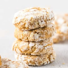 a stack of cookies with powdered sugar on top