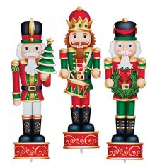 three nutcrackers are standing next to each other with christmas decorations on them