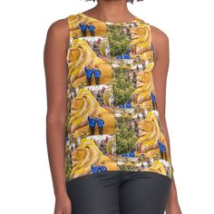 Women's sleeveless tank with vivid edge-to-edge sublimation print on front. Spliced materials for comfort. Front panel made from silky chiffon and solid color black or white jersey back. Sizes available XS- 2XL. 2017 Rose Parade in Pasadena, California Lions Club International - “Celebrating 100 Years of Service”: The float represents 1.4 million members in 210 countries who subscribe to the service organization’s centennial theme, “Where there is a need, there is a Lion.” The base of the float Sleeveless Tops With Sublimation Print For Summer, Yellow Printed Sleeveless Top, Lions Clubs International, Celebrating 100 Years, Lions Club, Rose Parade, Pasadena California, White Jersey, A Lion