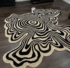 a black and white area rug on the floor