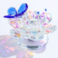 a crystal flower with two blue butterflies on it