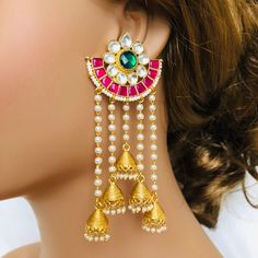 Multicolor Jadau Kundan Jhumka/ Pachi Kundan Jhumka/ Sabyasachi Kundan Earrings/ Punjabi Kundan Earrings/ Jadau Indian Traditional Earrings Features Fine Kundan earrings with 22 K gold plating Handcrafted To Perfection Light Weight Earrings Earring length- approx. 4 inches Comes with Push Back Closure Made in Brass Facebook: www.facebook.com/shoparyafashions Pinterest: www.pinterest.com/aryafashions Instagram: www.instagram.com/shoparyafashions Twitter: www.twitter.com/aryafashions Email: info@a Temple Jewelry Style Jhumkas For Navratri, Temple Jewelry Jhumkas For Navratri, Temple Style Drop Jhumkas For Navratri, Festive Tilla Drop Earrings Jhumkas, Festive Tilla Jhumkas In Drop Shape, Temple Style Jhumkas For Navratri, Navratri Latkans Jhumka Drop Earrings, Temple Jewelry Chandbalis With Latkans, Temple Jewelry Jhumkas With Latkans For Festivals