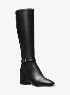 With a clean, classic silhouette and a slim buckled strap at the ankle, the Ella is the wear-with-everything boot you’ve been looking for. The dark, stacked heel extends the long line of the boot and keeps you walking tall day and night. Black Knee-high Boots With Reinforced Block Heel, Michael Kors High Heels, Black Medium Width High Heel Knee-high Boots, Black Medium Width Knee-high Boots, Black Knee-high Boots With Stacked Heel, Medium Width, Heeled Combat Boots, Heel Boots For Women, Tall Knee-high Heeled Boots With Zipper Closure, Michael Kors Boots