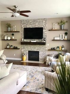 a living room filled with furniture and a flat screen tv mounted on the wall above a fireplace