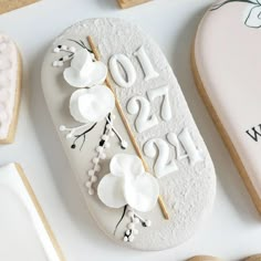 decorated cookies with numbers and flowers on them