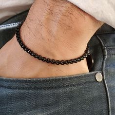 "This simple and fine chain bracelet is made of a 4mm thick black stainless steel chain and a 10mm diameter dangling charm. This stylish bracelet is the perfect addition to accompany any outfit, it looks amazing either with a formal outfit or with jeans and a shirt. You can also personalize your bracelet by adding an engraved text on the charm on one side of both sides up to 5 characters maximum or two words of 5 characters on top of each other. If you only want the chain without engraved charm hanging, just select the \"No Charm\" option at checkout. You may also specify the font to use for the charm engraving in the personalization section, otherwise the same font as the product photo will be used (Arial). Consult product photo to see the fonts photos and a demo of the font. Option 1 Ari Men Chain, Times New Roman, Stylish Bracelet, Initial Bracelet, Engraved Gifts, Bracelet Black, Bracelet Clasps, Engraved Items, Formal Outfit