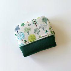 Little trees small fabric zipper bag, coin purse, pouch bag, cosmetic bag Handmade in the UK Size:  - approximately 10cm (L) x 9cm (H) with 2.5cm base Material:  - 100% cotton (both outer and inner layer) - YKK zipper closure Notes:  - The position of pattern prints may slightly vary due to the different batches of the fabric - The actual color may slightly vary due to lighting effects and monitor settings Green Rectangular Wallet With Zipper Pouch, Green Zipper Pouch Coin Purse As Gift, Green Coin Purse With Card Slots For Personal Use, Green Rectangular Coin Purse For Everyday Use, Green Rectangular Coin Purse With Zipper, Rectangular Green Coin Purse With Zipper, Green Pouch Coin Purse As Gift, Green Coin Purse For Daily Use, Green Wallets With Zipper Pouch For Daily Use