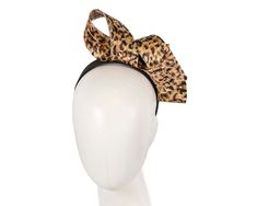 Made in Melbourne, this unusual leopard animal print fascinator is made from finest fabric and placed on the headband. Want to be different? Then this headpiece is for you.  Made in Australia  Unusual design  Comfortable headband Comfortable Headbands, Leopard Animal, Unusual Design, Fine Fabric, Be Different, Fascinator, Headpiece, Hats For Women, Melbourne