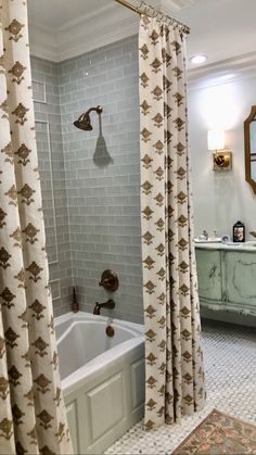 a bath room with a tub and a mirror