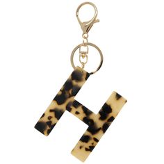 the letter h is made out of tortoiseshell and has a key chain