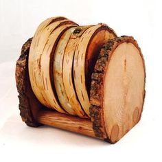 several slices of wood are stacked on top of each other to form a log holder