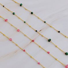 Elevate your everyday look with our Dainty Precious Stone Bead Necklace. The delicate chain showcases varying sizes of beautifully placed stone balls, offering a touch of daintiness to any outfit. Perfect for layering or wearing on its own, this versatile necklace will effortlessly take you from casual to dressy occasions. 18k gold plated brass, natural stone beads Lead and Nickel free Designed in US, crafted in China Dainty Necklace With Round Beads, Dainty Beaded Necklaces With Round Beads And Adjustable Chain, Delicate Beaded Necklaces With Adjustable Chain, Delicate Necklaces With Round Beads Chain, Gift Crystal Necklaces With Delicate Chain And Round Beads, Delicate Beaded Chain Necklace With Round Beads, Adjustable Necklace With Satellite Chain, Dainty Beaded Chain Necklace, Gift Delicate Chain Beaded Necklace With Round Beads