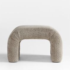 an upholstered bench made out of wool and leather, with the seat folded back