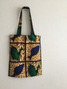 "Handmade Ankara fabric tote bag. Lined and boxed with one inside glued-on pocket Great for gift giving,  light load shopping, casual outings, beach, travel, storage.  Size 17\"x14\". Strap drop 11\".    Being handmade it may or may not have a slight irregularity. Please ask questions." Fabric Tote Bag, Phone Wallpaper Pink, Fabric Tote Bags, Diy Bags, Wallpaper Pink, Fabric Tote, Ankara Fabric, Travel Storage, Handmade Fabric